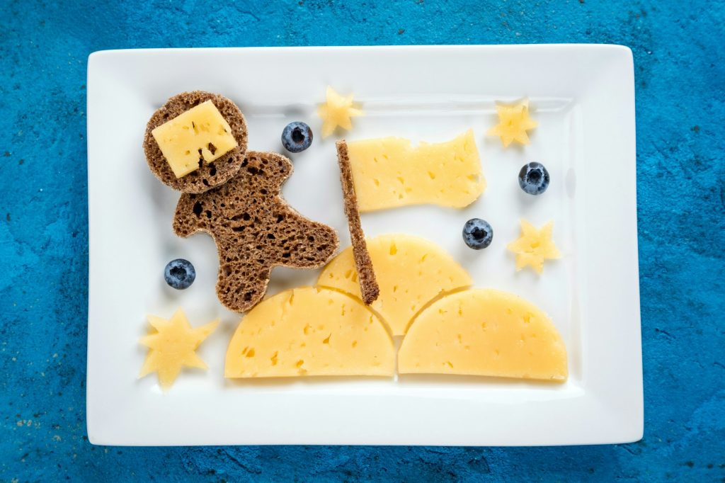 Funny toast with cheese and berries for kids breakfast or lunch